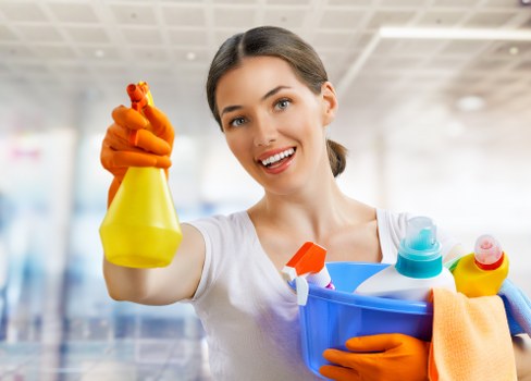 Carpet cleaning professional preparing equipment for a UK service appointment