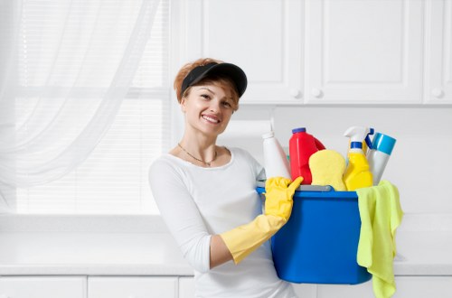 Carpet cleaning professional protecting flooring and nearby furnishings in Mayfair